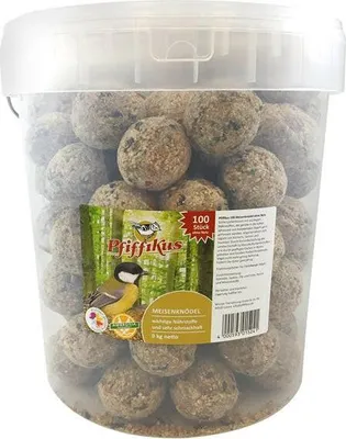 A clear plastic bucket filled with bird food balls, with a label showing a bird and product information.
