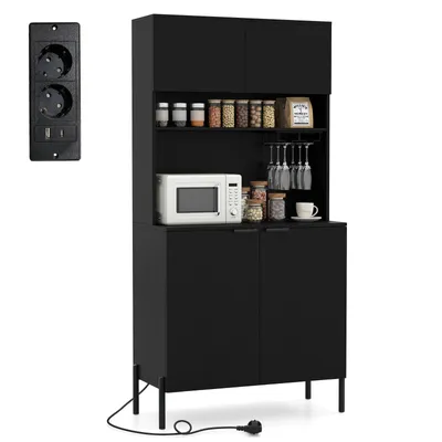 A black kitchen cabinet with shelves, a microwave, and various kitchen items, next to a black electrical outlet.