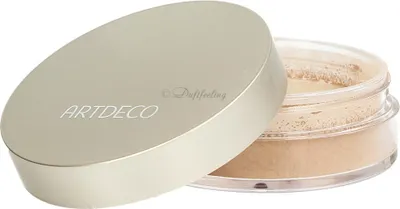 A makeup powder container with its lid slightly ajar, revealing the powder inside.