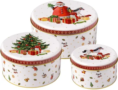 A set of three round Christmas-themed tin boxes.