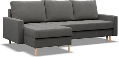 A dark gray sectional sofa with a chaise lounge is shown against a white background.