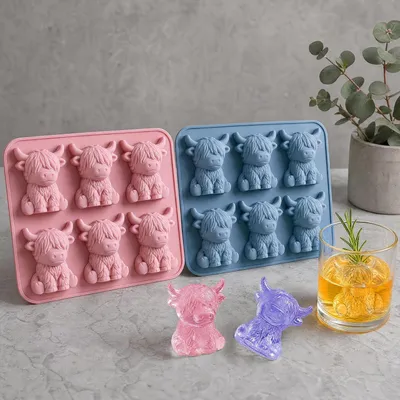 Immagine prodotto di Stampini in silicone per cubetti di ghiaccio - Set da 2 - Motivo: mucca highland - 6 cavità