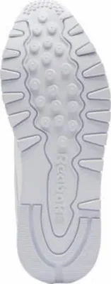 The sole of a white Reebok sneaker.