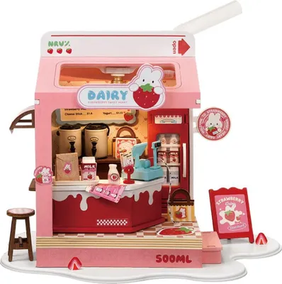 A miniature dollhouse model of a pink and red strawberry-themed dairy shop.