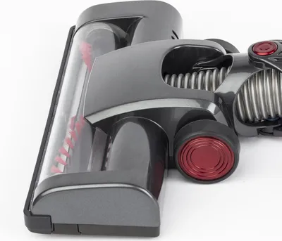 Close-up view of a vacuum cleaner head on a white background.
