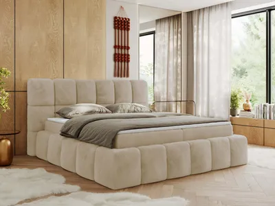 A bedroom with a large bed.