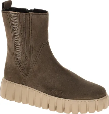 A single brown boot with a beige sole is shown against a white background.