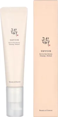 A product shot of a tube of eye serum and its packaging.