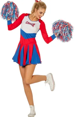 A woman dressed as a cheerleader posing with pom-poms.