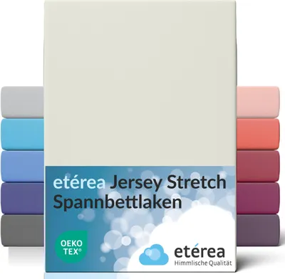 A cream-colored fitted sheet is shown, with various colored fitted sheets stacked behind it. The product name and brand are displayed on a blue label at the bottom of the main sheet.