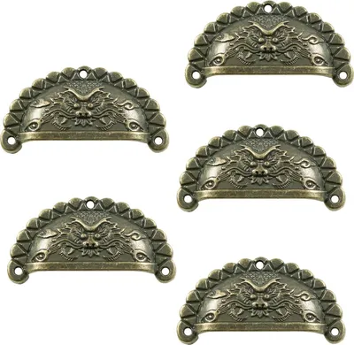 A collage of five bronze-colored drawer pull handles, each featuring a dragon design.