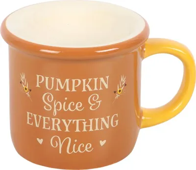 A ceramic mug with a fall-themed design and text.