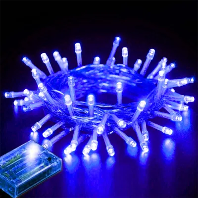 A close-up of a string of blue LED lights with a battery pack.
