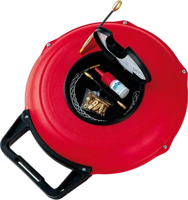 A red cable puller device with its compartment open, showing tools and accessories inside.