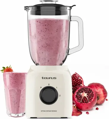 A cream-colored Taurus Optima Vintage 1500 Max blender with a glass pitcher filled with a pink smoothie, a glass of smoothie, and pomegranates on a white background.