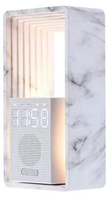 A digital alarm clock with a marble-effect casing and a light-up display.