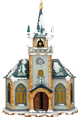 A festive, snow-covered church model, likely for holiday decoration.