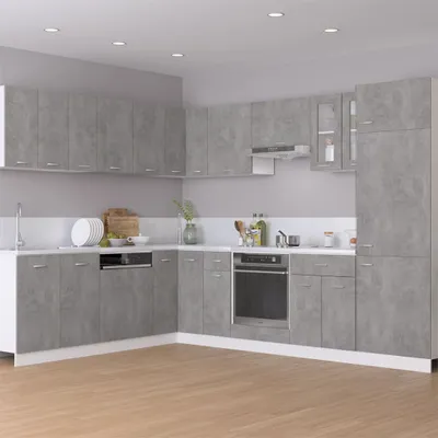 A modern kitchen with gray cabinets and appliances.
