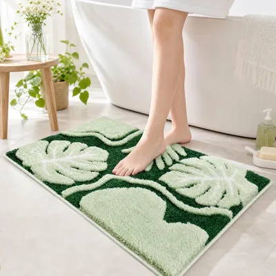 Produktbild von Rutschfeste Badmatte aus Mikrofaser mit Monstera-Muster