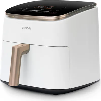 A white Cosori air fryer with a gold handle and a black digital display.