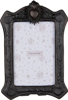 A black ornate picture frame with a floral insert.