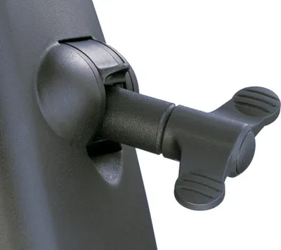 A close-up view of a black plastic locking mechanism with a wingnut-style handle.