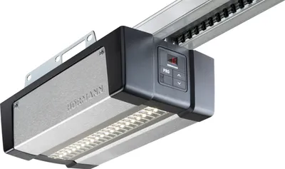 A close-up, studio shot of a garage door opener motor head.