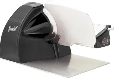 A black and white electric slicer on a silver base.
