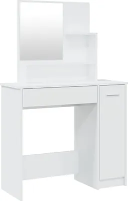 A white vanity table with a mirror and shelves.