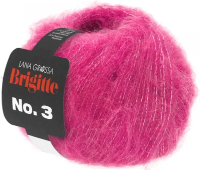 A ball of pink yarn with silver threads, with a black label attached.