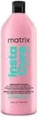 A pink bottle of Matrix Total Results Insta Cure Build-A-Bond Shampoo.