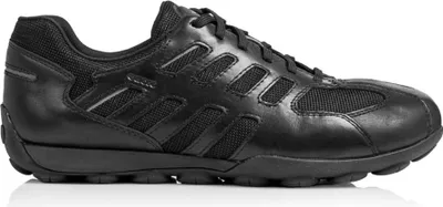 A black leather and mesh sneaker shown from the side.