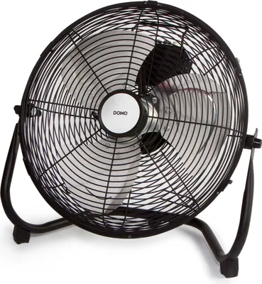 A black floor fan with a silver grille and blades, standing on a white background.