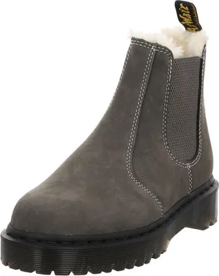 A single Dr. Martens boot is shown against a white background.