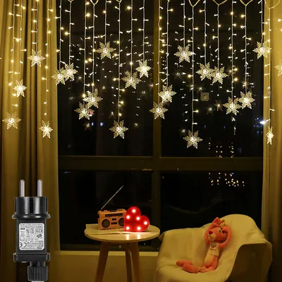 Produktbild von ROSNEK Schneeflocken-Lichtervorhang Warmweiß, 94 LEDs, 31V. Wasserdicht, 8 Modi, Timer, Speicherfunktion. Maße: B 1,8m, H 50/80/100cm. Koppelbar bis 4 Sets. Ideal für Fenster & Weihnachten. 30.000h Lebensdauer.
