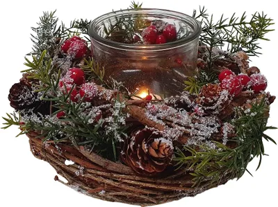 A Christmas wreath with a glass candle holder in the center, decorated with pine cones, greenery, and red berries, all dusted with artificial snow.