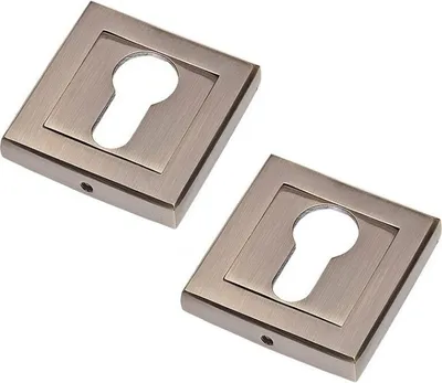 Two square keyhole escutcheons with a bronze finish, presented on a white background.