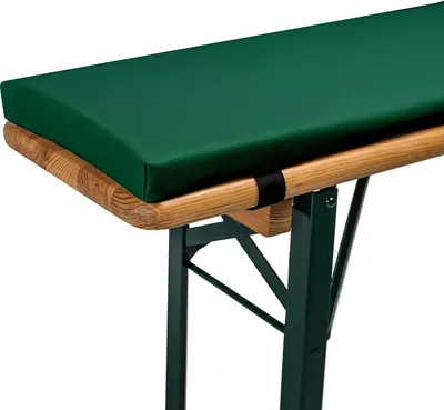 Close-up of a green cushion on a wooden and metal bench.