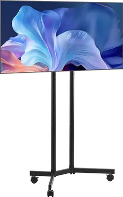 A black rolling TV stand with a large flat-screen TV mounted on it, displaying a colorful abstract image.