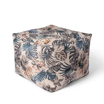 A single cube-shaped ottoman with a tropical floral pattern, shown from a three-quarter angle against a white background.