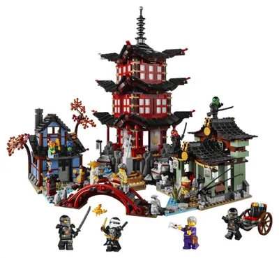 A LEGO® Ninjago® 70751 Tempel des Airjitzu playset with minifigures and a carriage.
