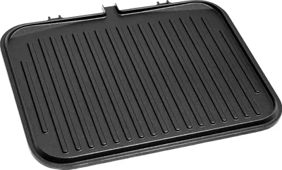 A close-up, top-down view of a black grill plate with raised ridges.