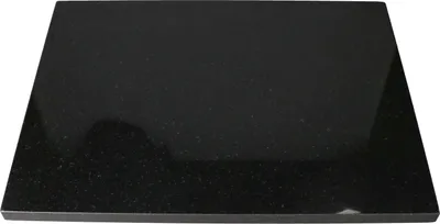 A black granite cutting board on a white background.
