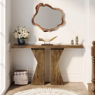 A farmhouse-style console table with decorative items in a hallway.