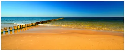 Produktbild von Wallario Premium Glasbild, freischwebende Optik, kräftige Farben, Größe 125 x 50 cm Motiv Sandstrand in orange - Blaues Meer - Blauer Himmel