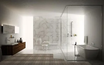 A modern, minimalist bathroom with a freestanding bathtub, glass shower enclosure, and a floating vanity.