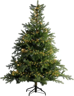 A green artificial Christmas tree with warm white LED lights and a black stand, isolated on a white background.