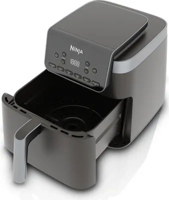 A studio shot of a Ninja air fryer with its basket pulled out.