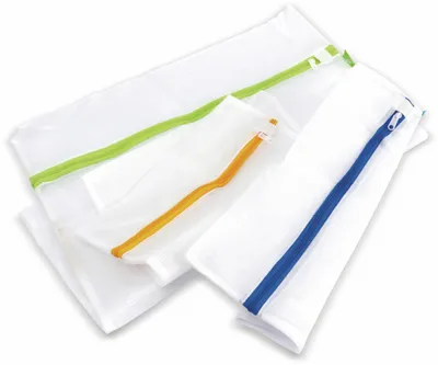 Three mesh laundry bags with colored zippers are laid out on a white background.