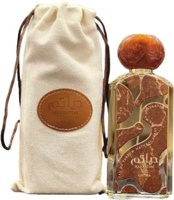 A perfume bottle and its fabric pouch are displayed against a white background.